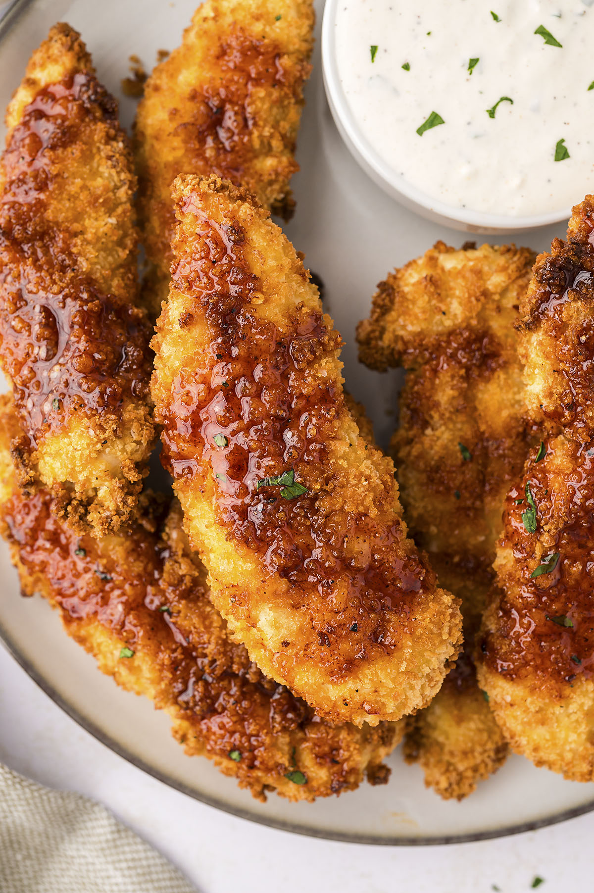 Crispy Air Fryer Hot Honey Chicken Tenders served with hot honey sauce